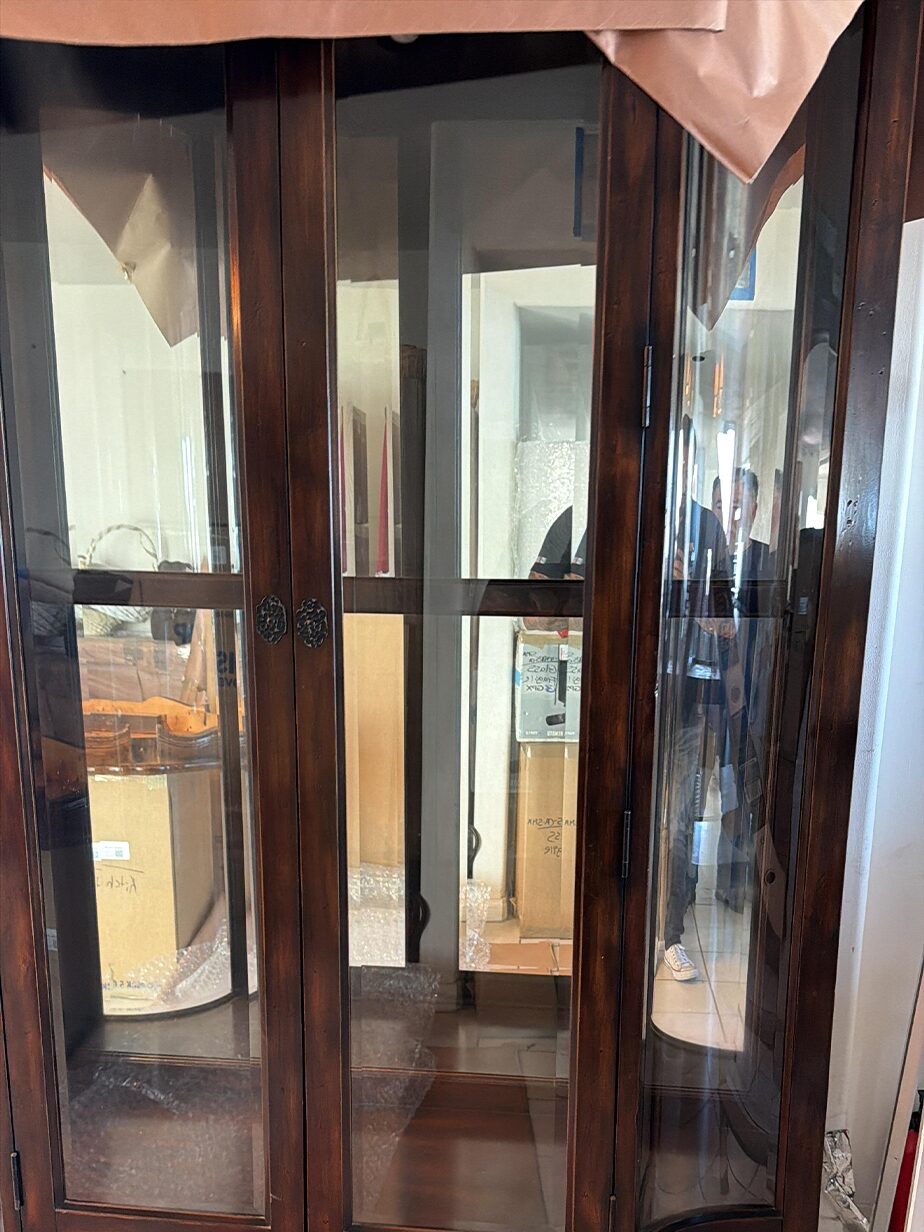 A glazed display cabinet prepared for wrapping.